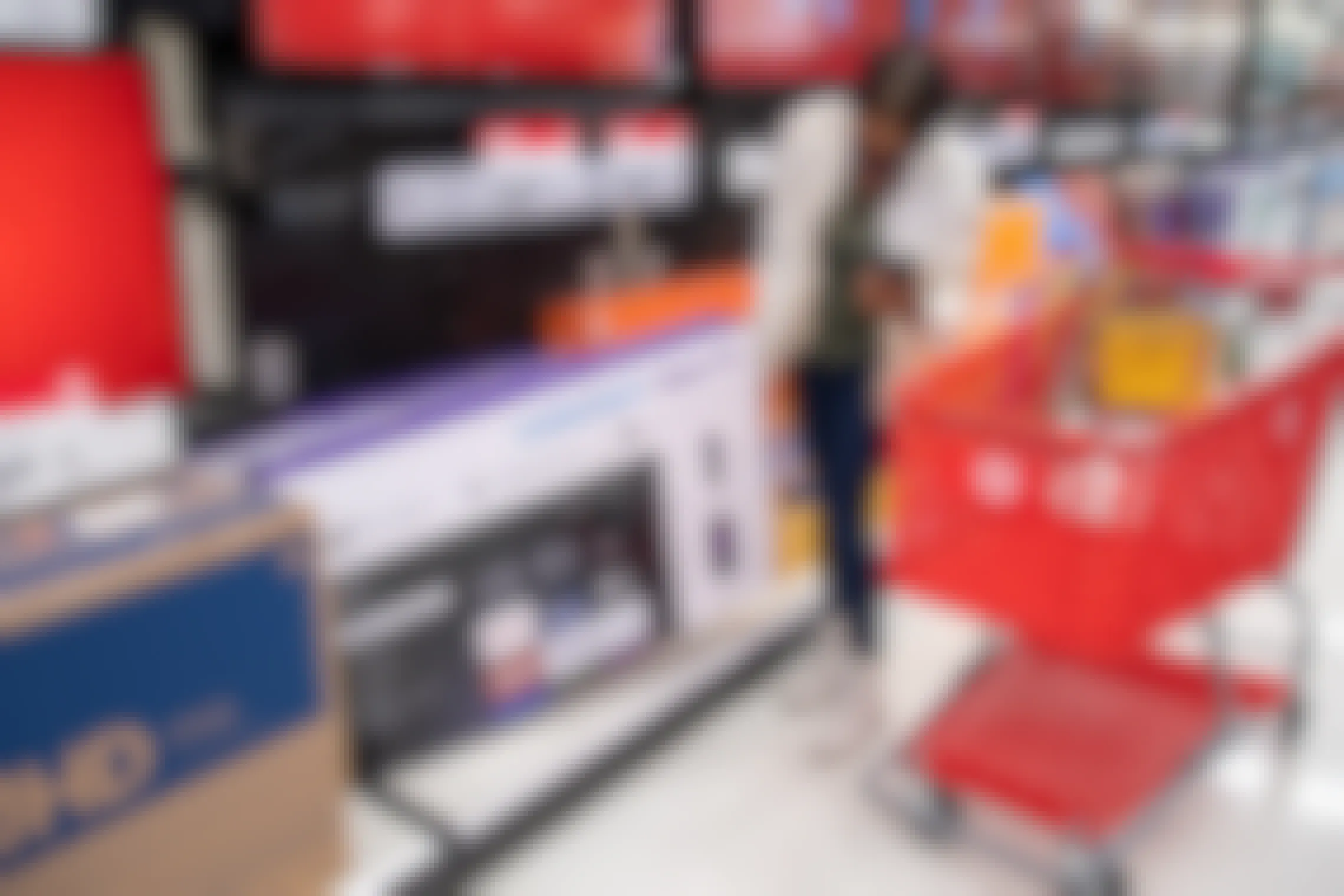 A woman looking at a tv inside Target