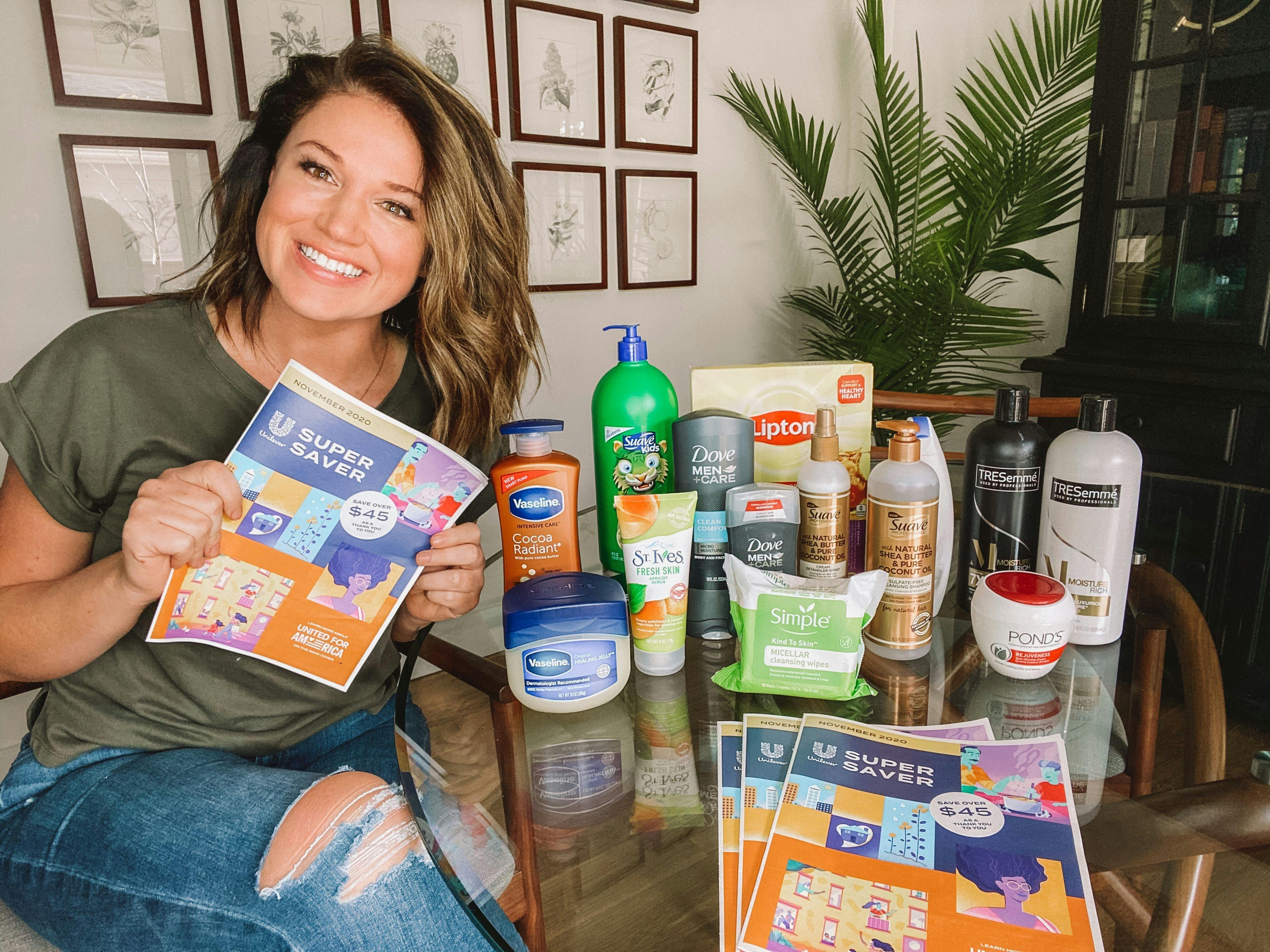 woman holding unilever insert and a bunch of products
