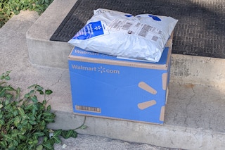 Walmart online order packages on a doorstep.