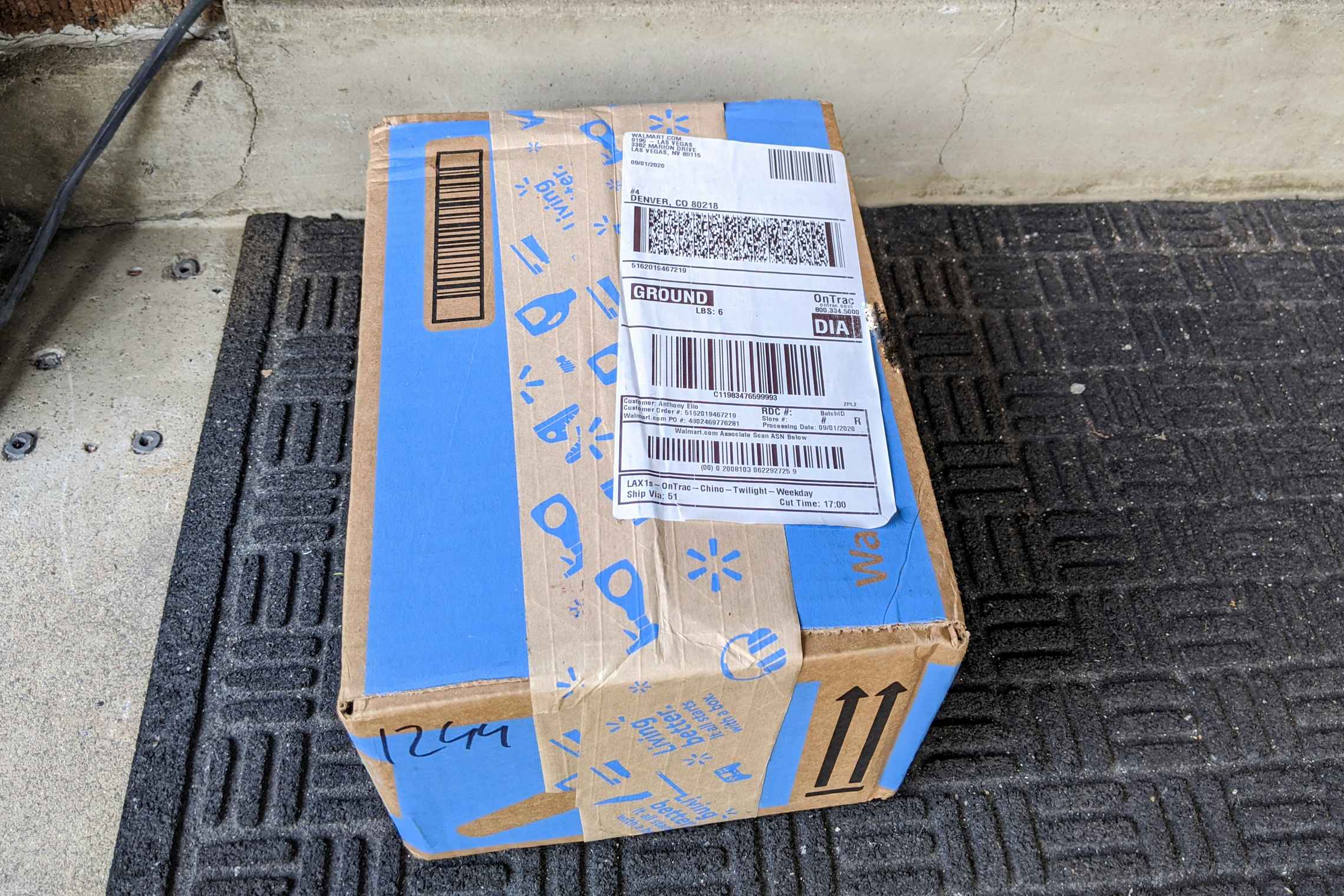 A Walmart package sitting on a doorstep