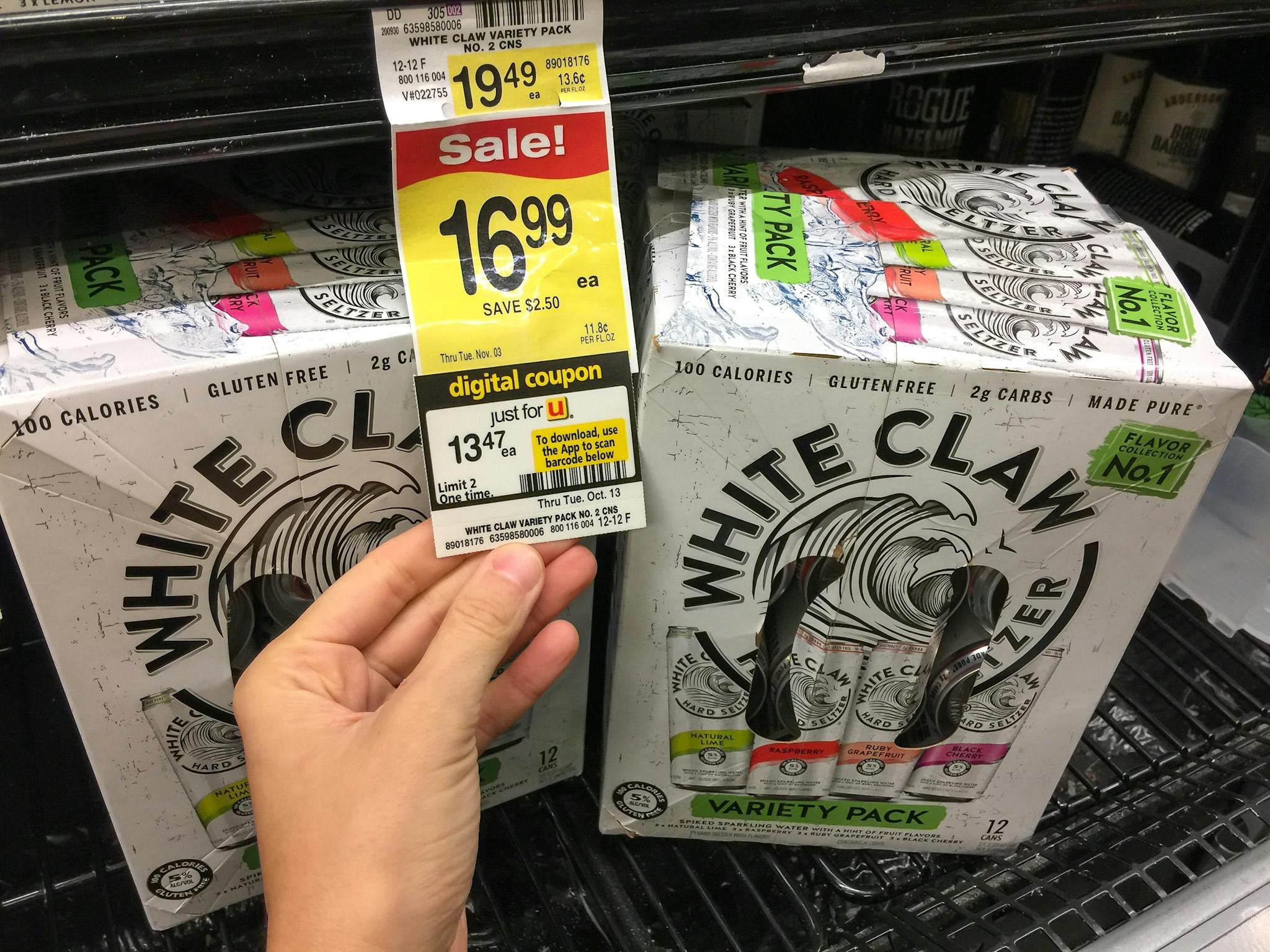 woman holding a price tag for White Claw