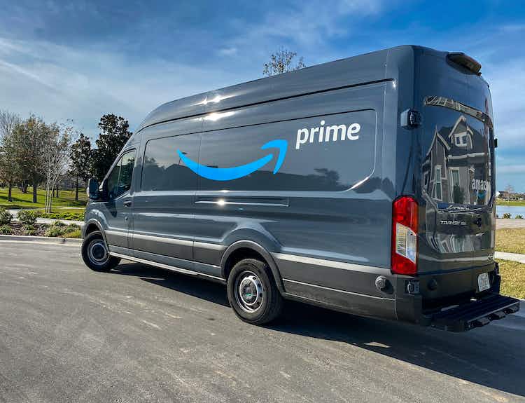 An Amazon Prime delivery van parked on a street.