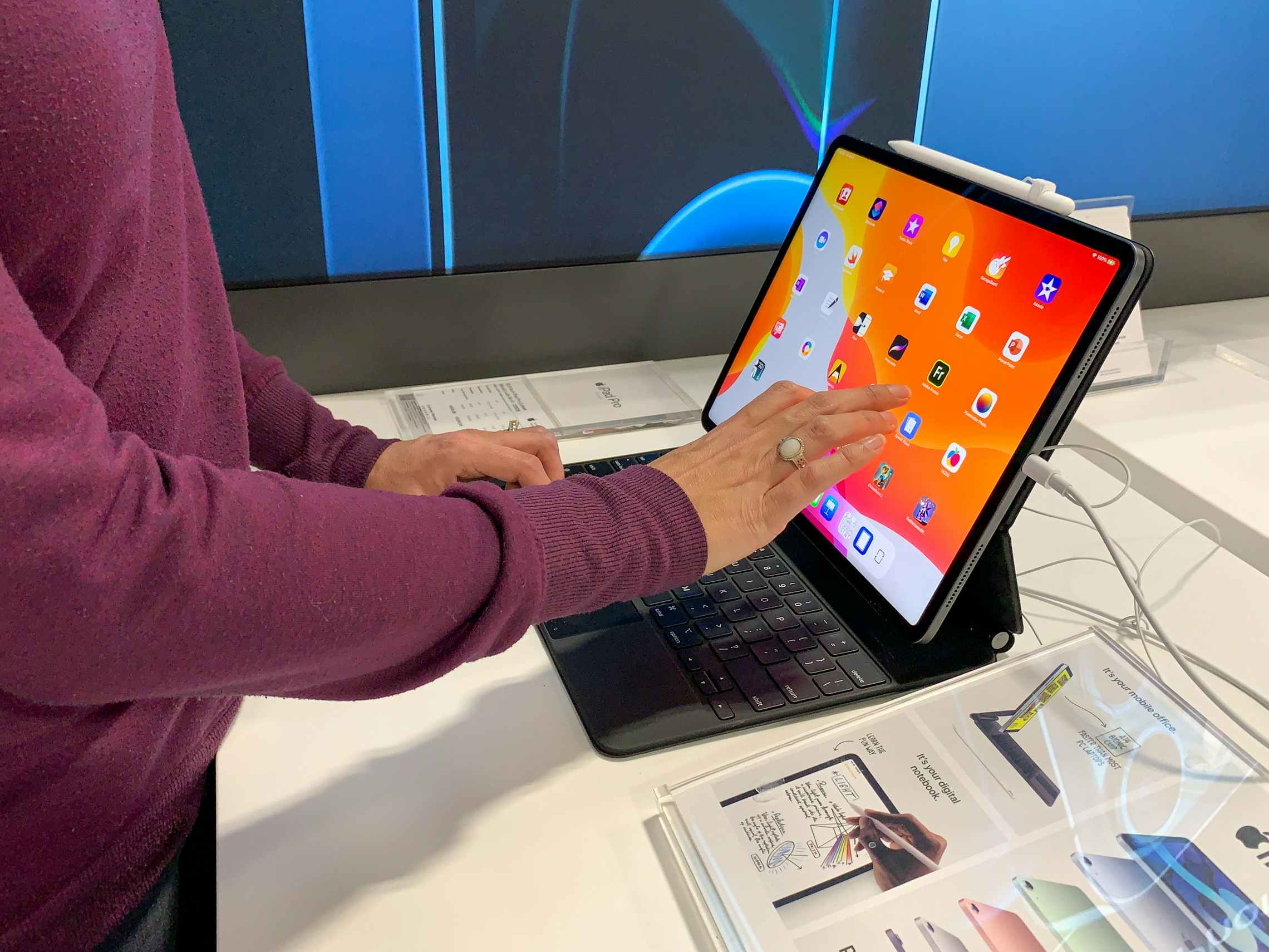 A woman inside Best Buy looking at an ipad.