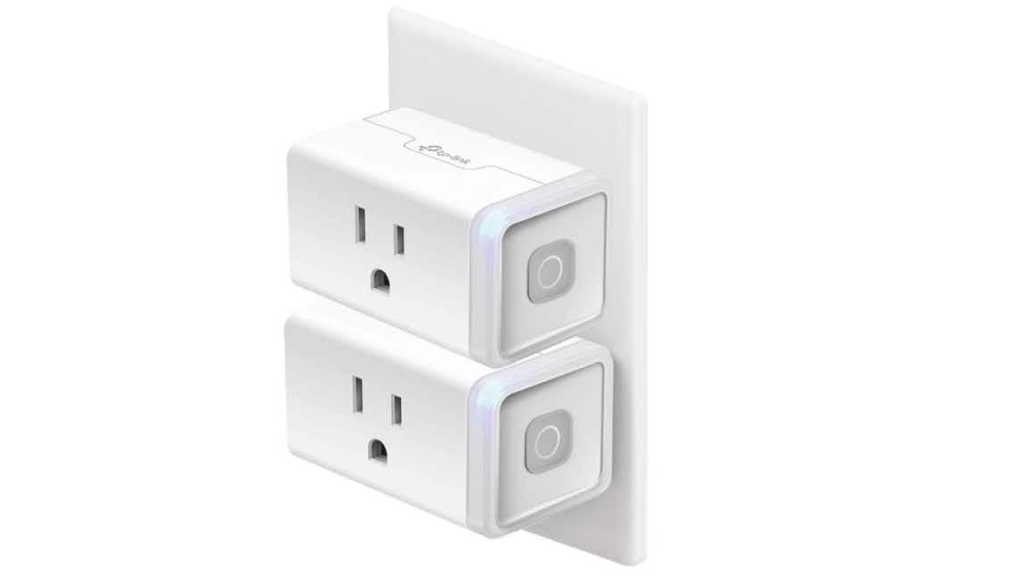Two smart plugs plugged into a wall outlet.