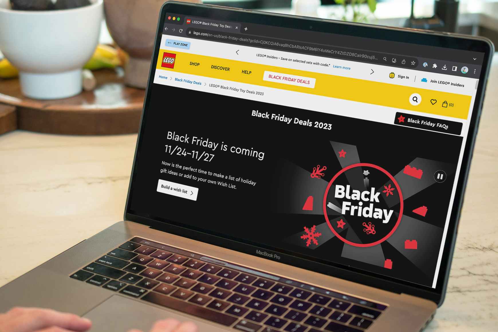 a laptop displaying the Lego website's black friday landing page