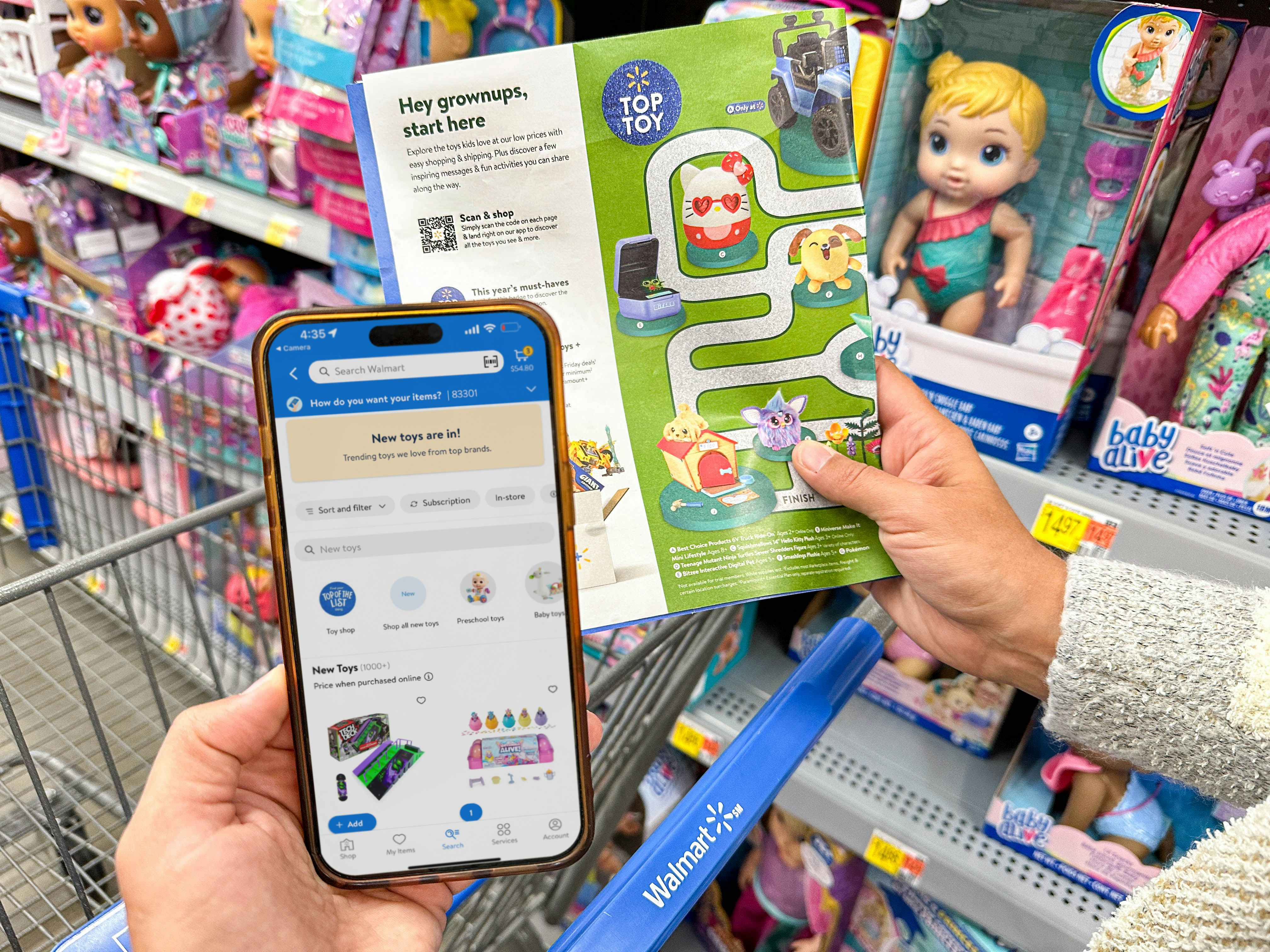 A woman's left hand holding her cell phone and her left hand holding a toy catalog getting ready to scan the qr code