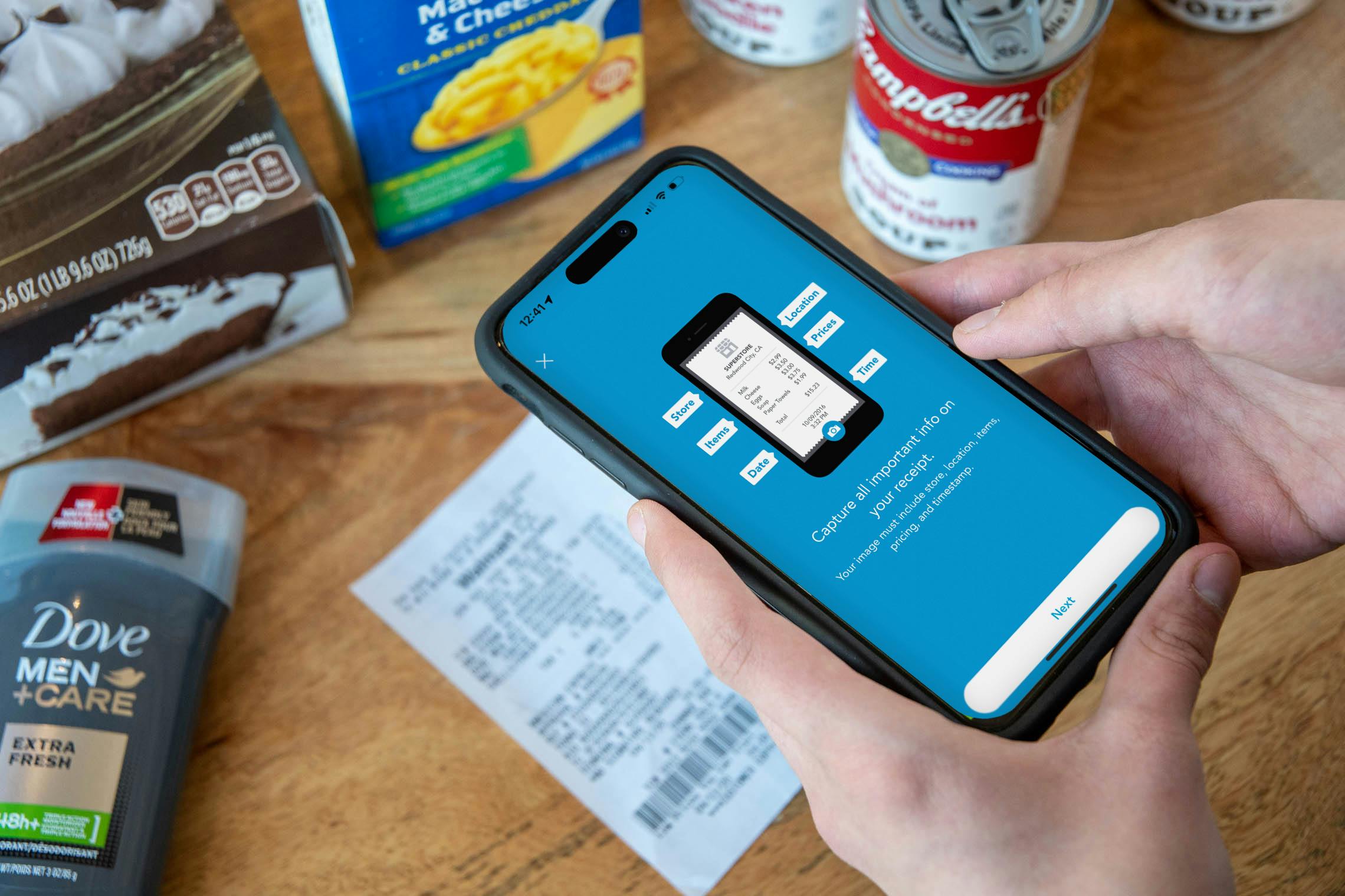 Someone about to scan a receipt with their phone using the Shopkick app