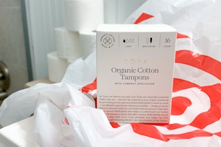 cora organic tampons in target shopping bag on the counter in a bathroom