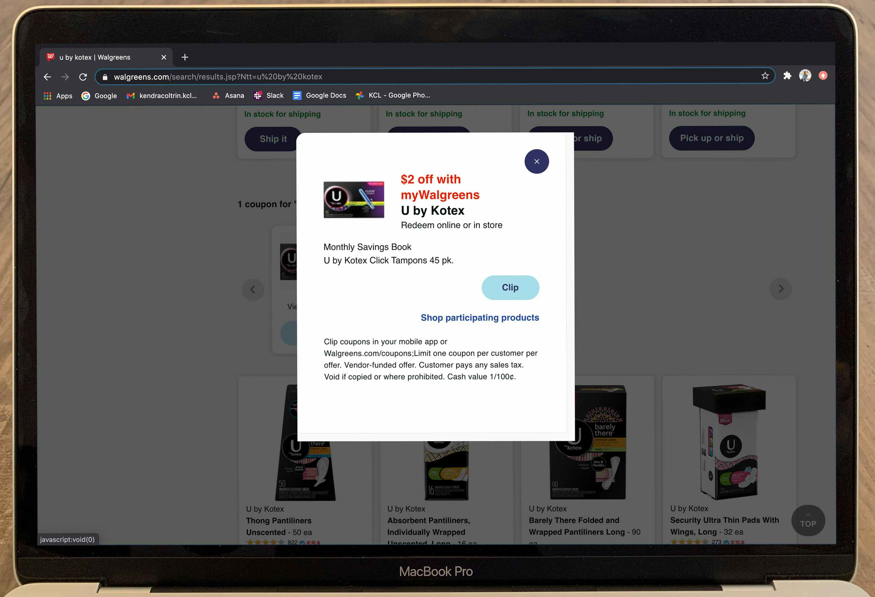 laptop with walgreens website pulled up showing u by kotex coupon
