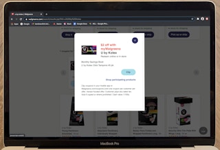 laptop with walgreens website pulled up showing u by kotex coupon