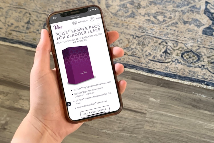 woman holding iphone with poise free sample on screen