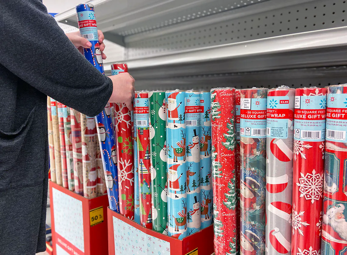 Someone shopping for gift wrap at a store