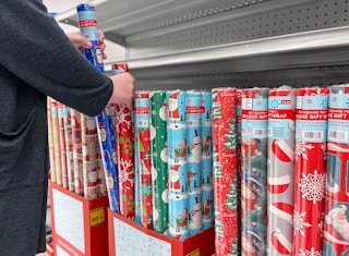 Someone shopping for gift wrap at a store