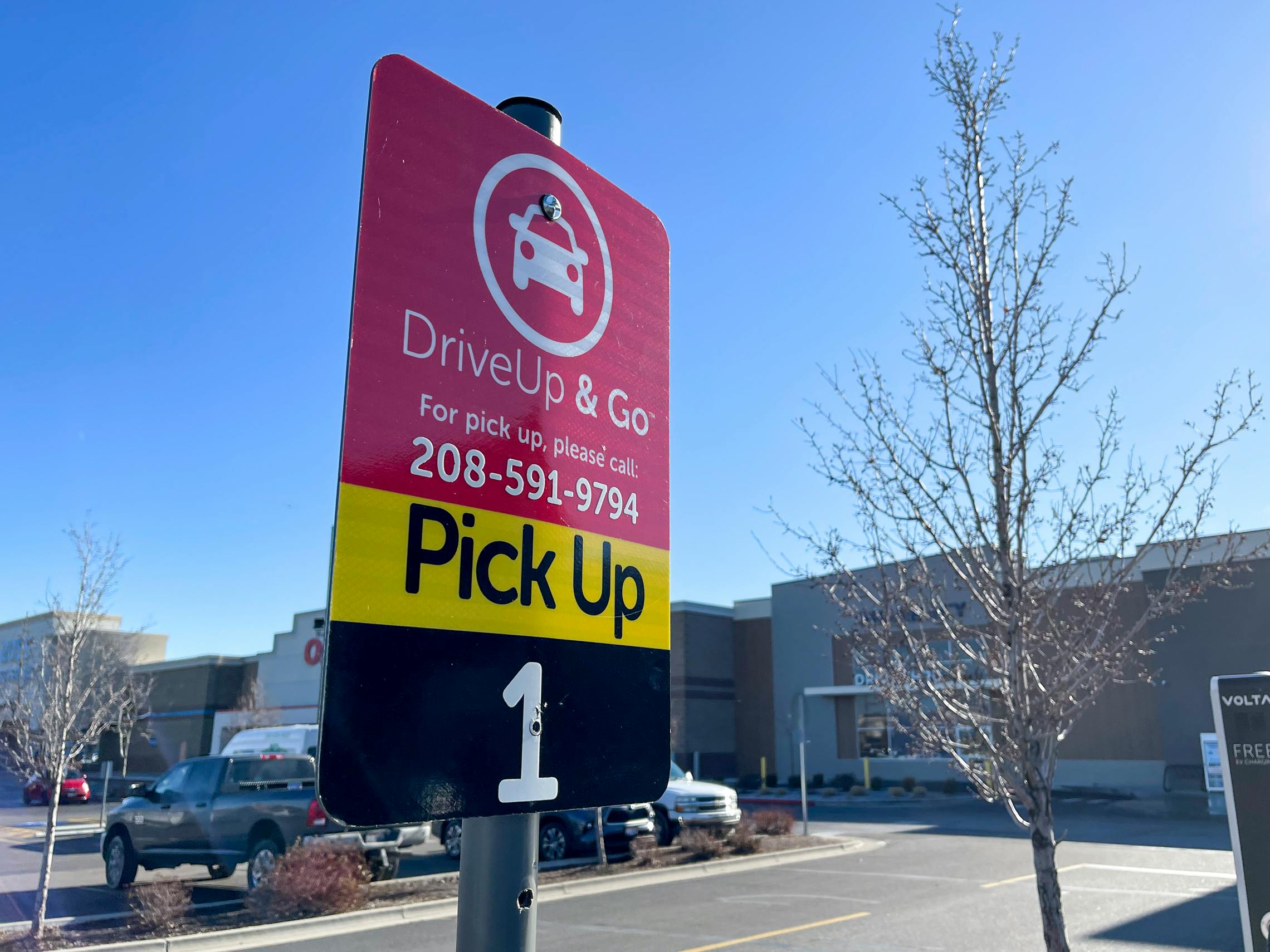 A Drive Up and Go pickup sign in a parking lot
