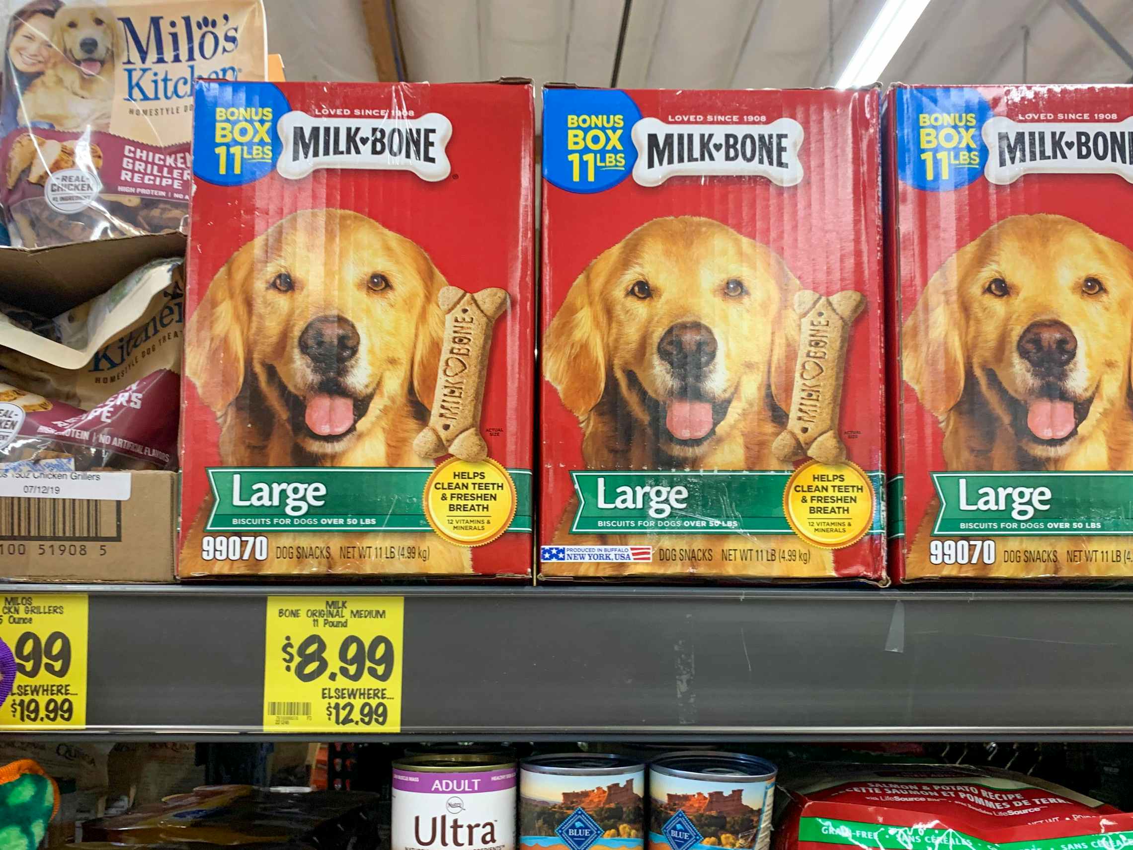 Boxes of Milk Bone dog treats on a shelf