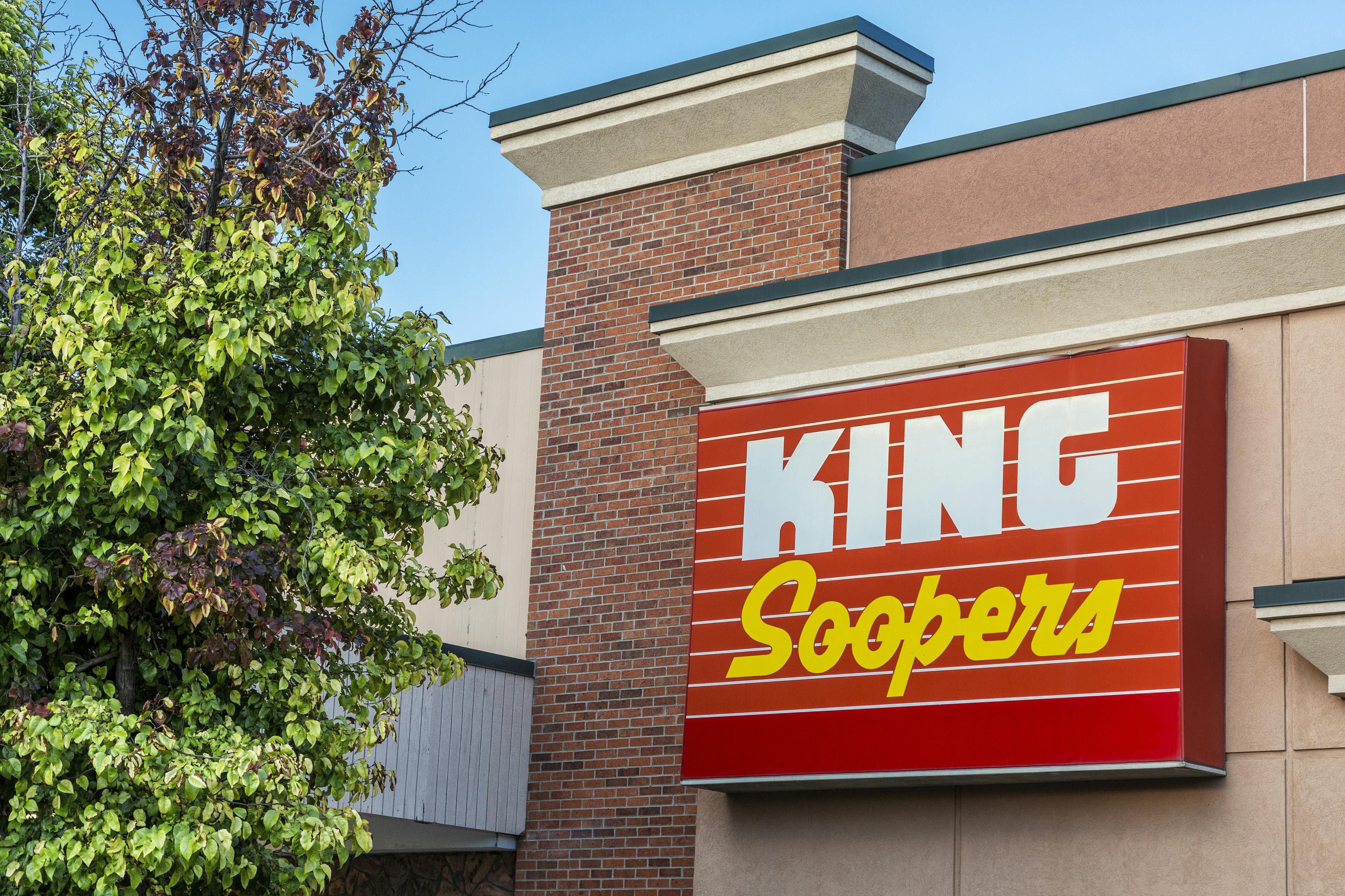 A King Soopers sign on the front of a building.