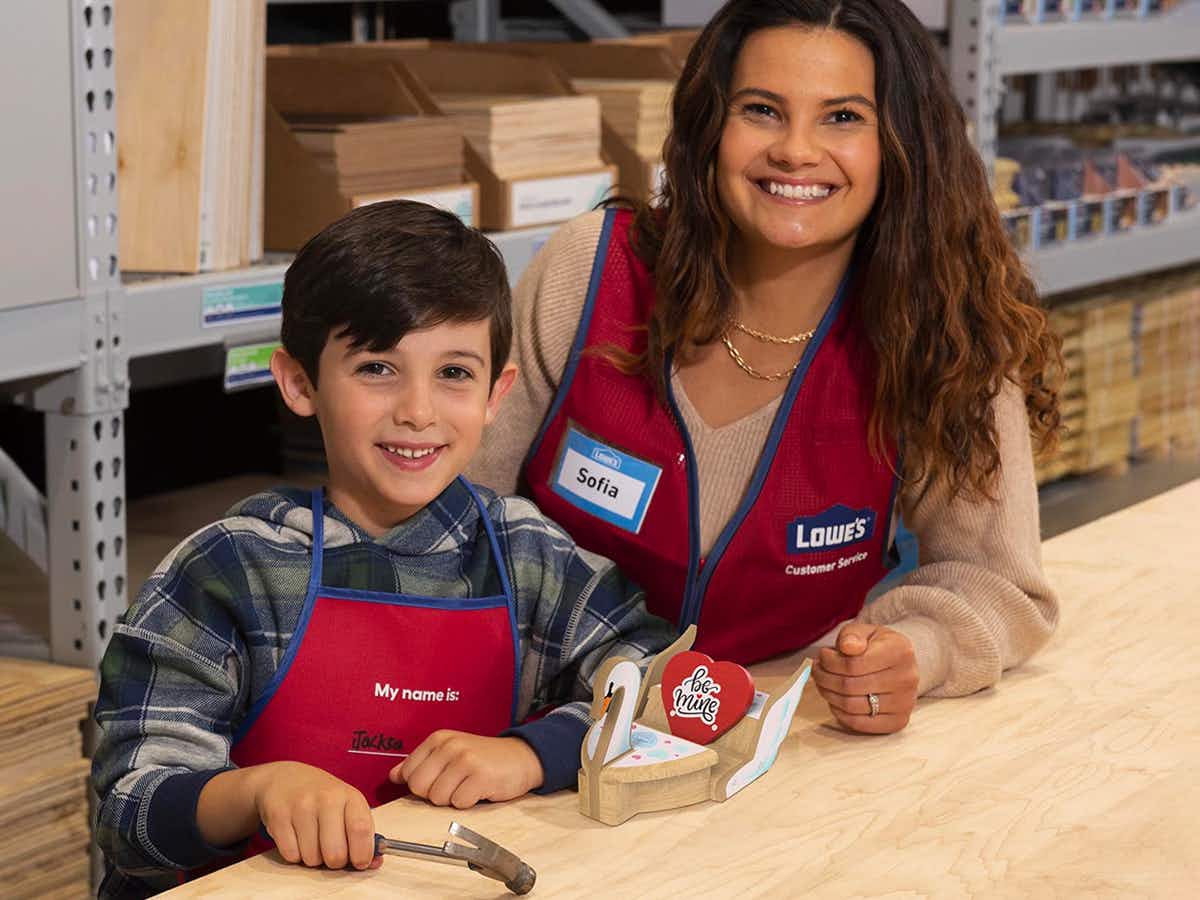 A child making a craft for the Lowe's Workshop for Valentine's Day 2023