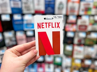netflix gift card being helpd up