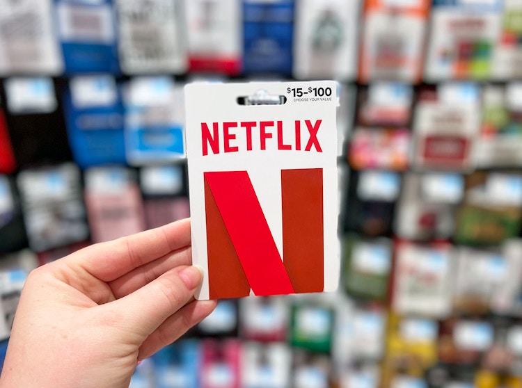 netflix gift card being helpd up 