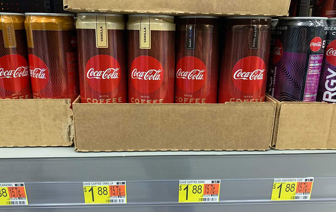 coca-cola with coffee in boxes on shelf with price tag