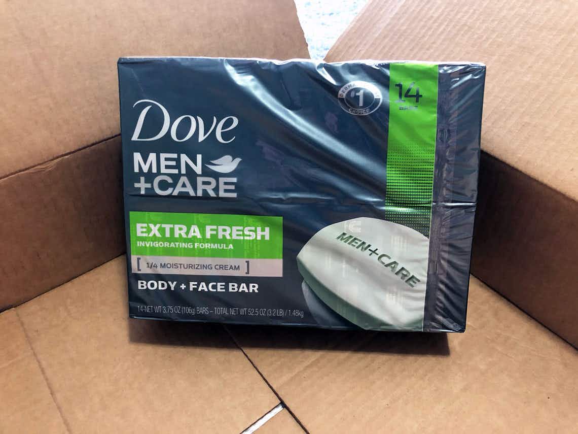 A package of Dove Men+Care soap in an open Amazon delivery box.