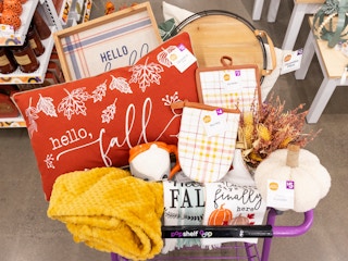 A Popshelf shopping cart filled with fall merchandise.