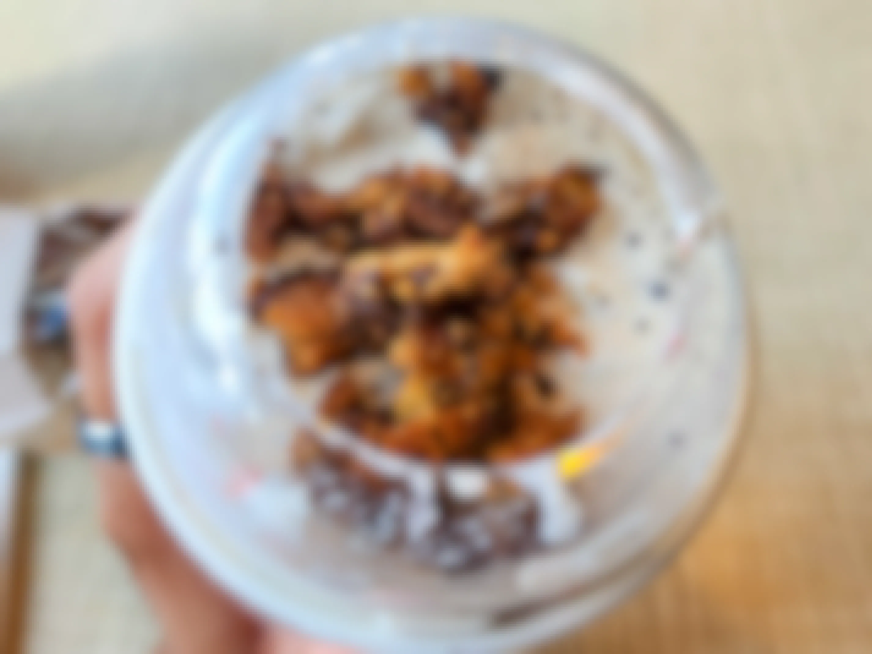 A close up on a Chick-fil-A milkshake with cookie crumbles added to it.