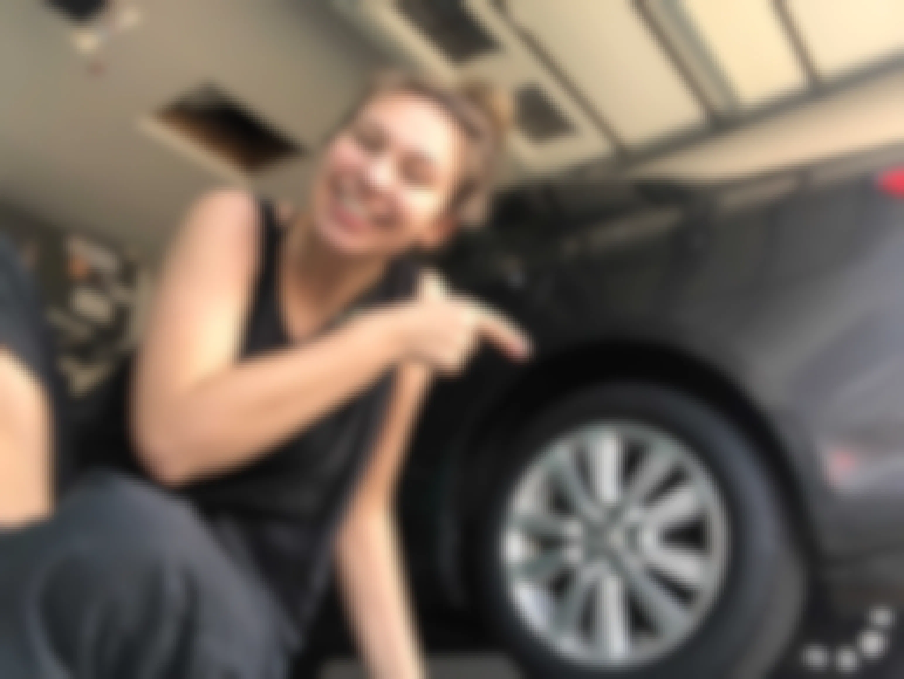 KCL employee points to new tires bought with stimulus check