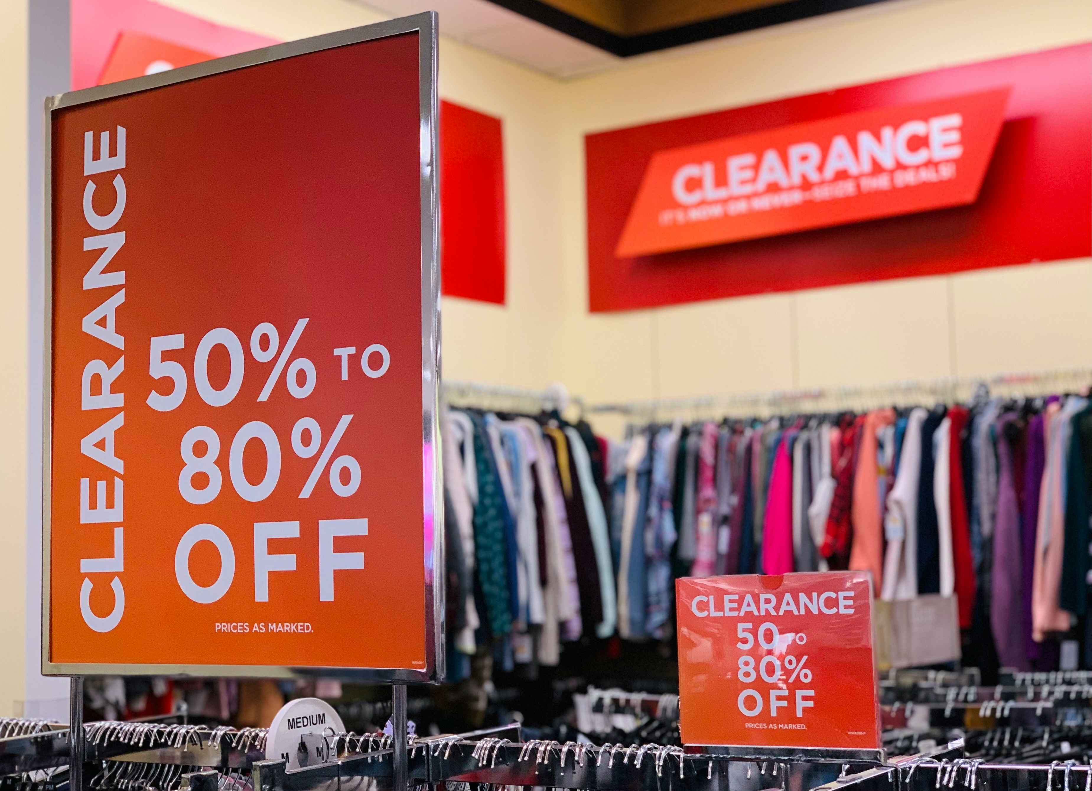 Kohls in store clearance racks with 50% to 80% off signs
