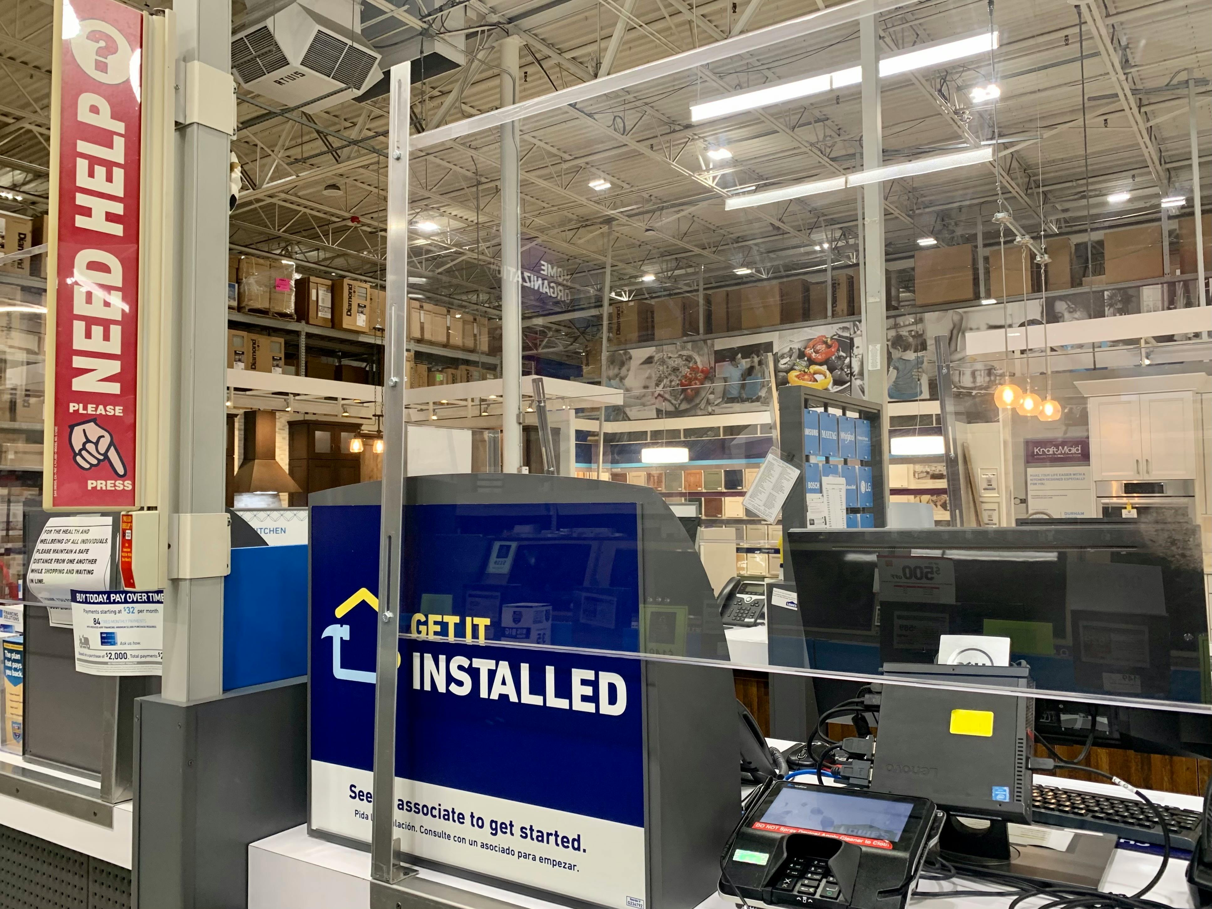 Lowes register with sign saying get it installed need help register desk