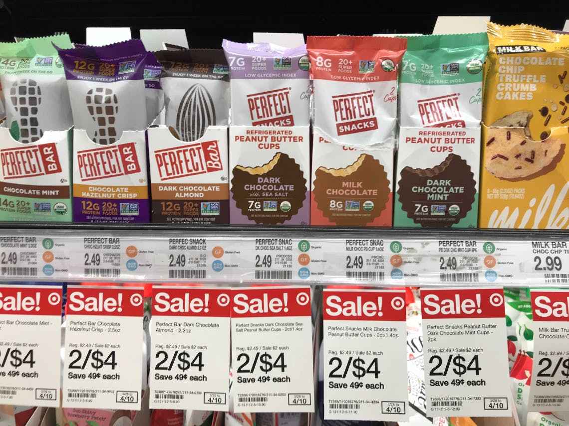 A shelf of Perfect Bars stocked in the refrigerated section in Target with sale tags advertising a 2/$4 sale.