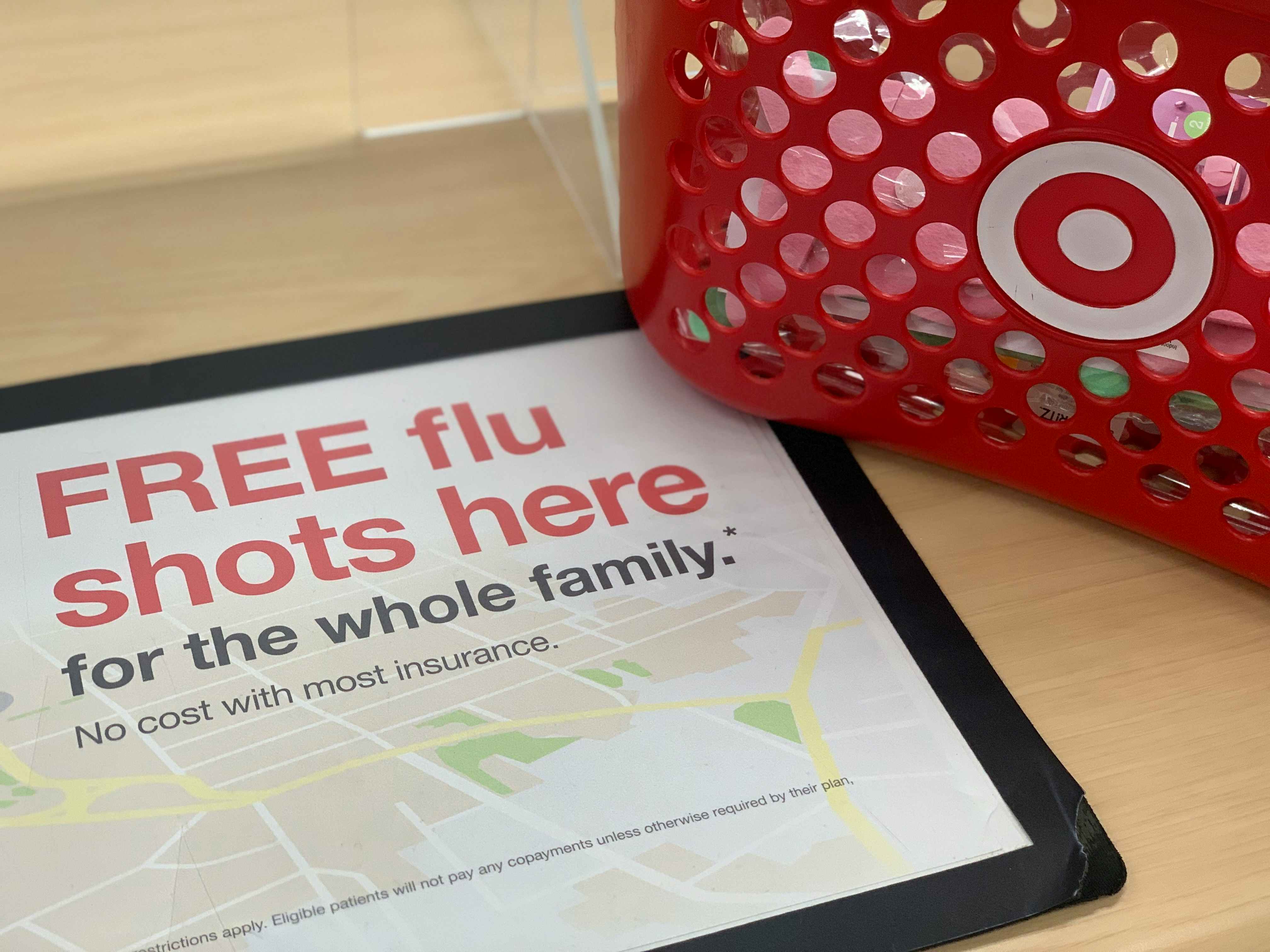 sign for free flu shot next to target basket