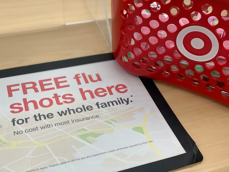 sign for free flu shot next to target basket