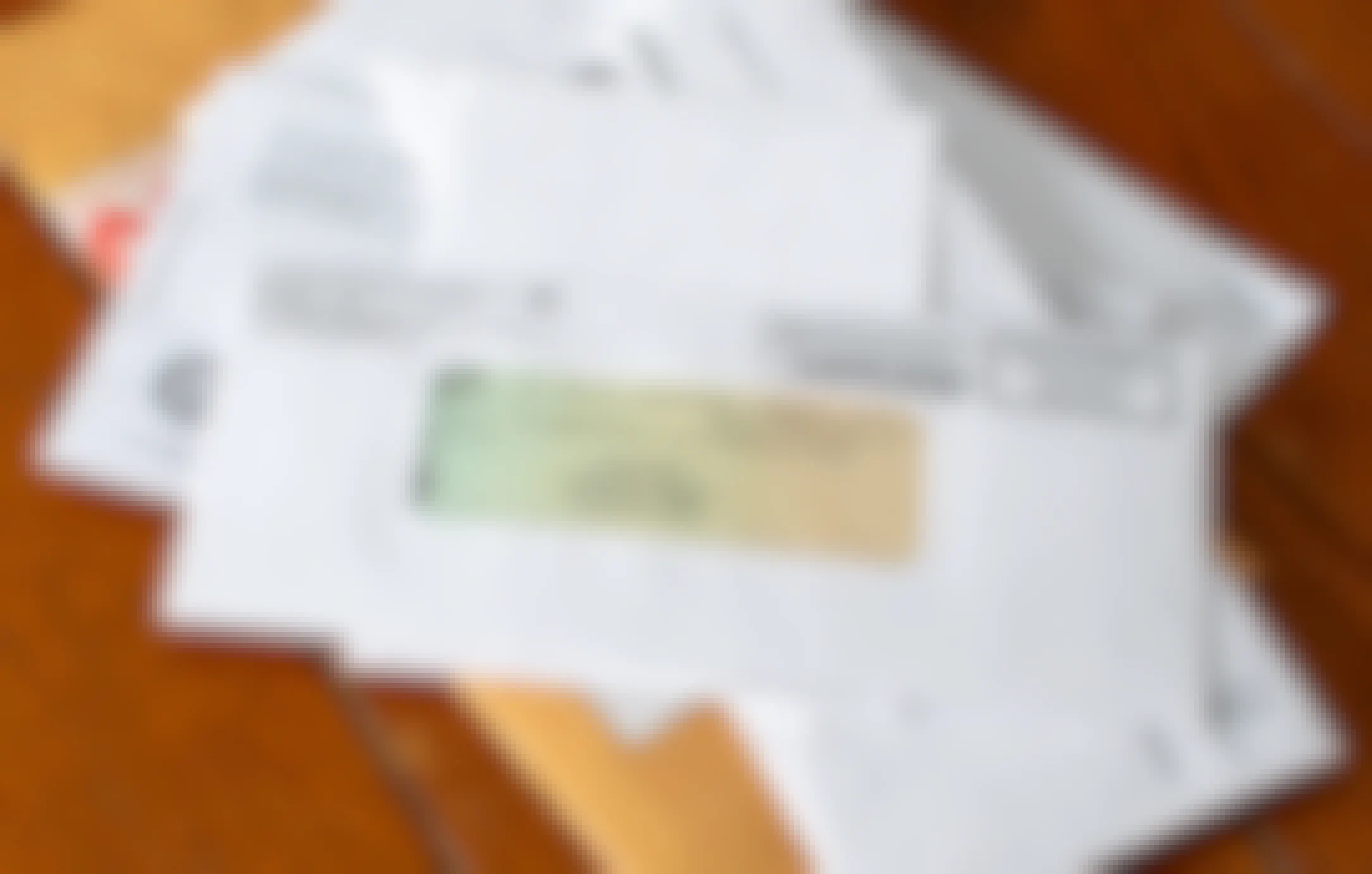 A pile of mail with a check from the US Treasury in an envelope on top of the pile.