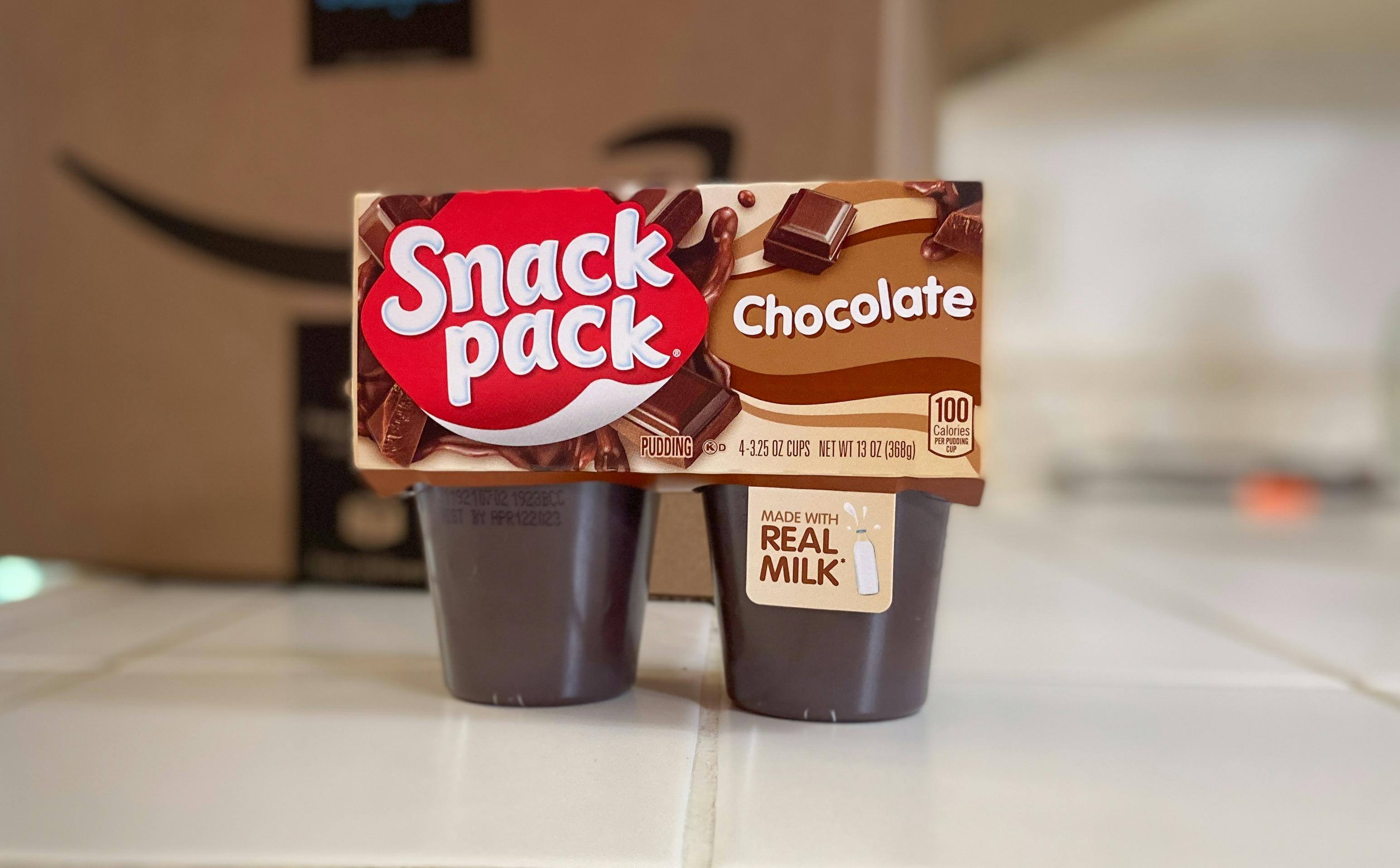 chocolate snack pack pudding on a counter in front of an amazon box