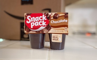 chocolate snack pack pudding on a counter in front of an amazon box