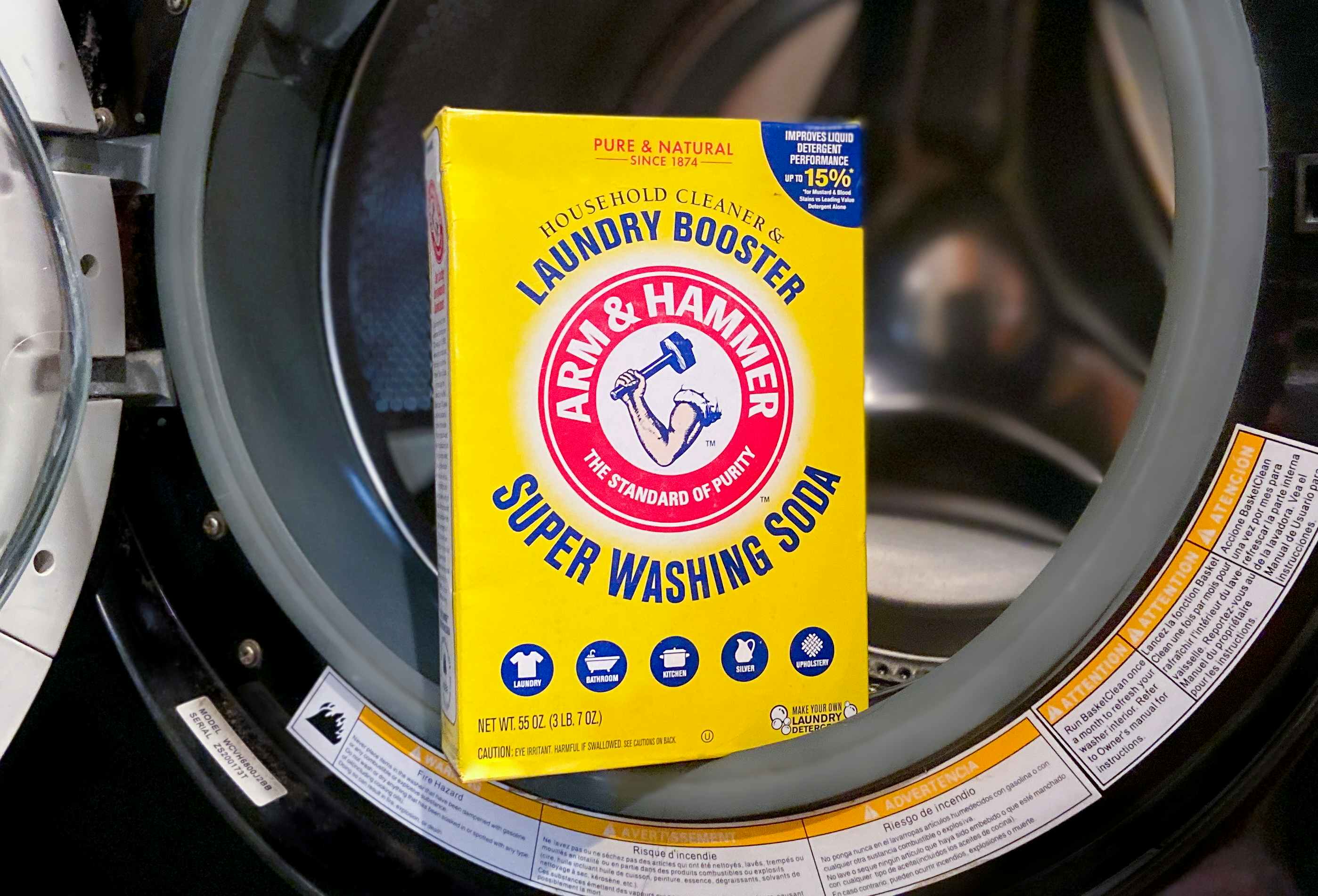 arm and hammer laundry booster super washing soda resting in a washing machine