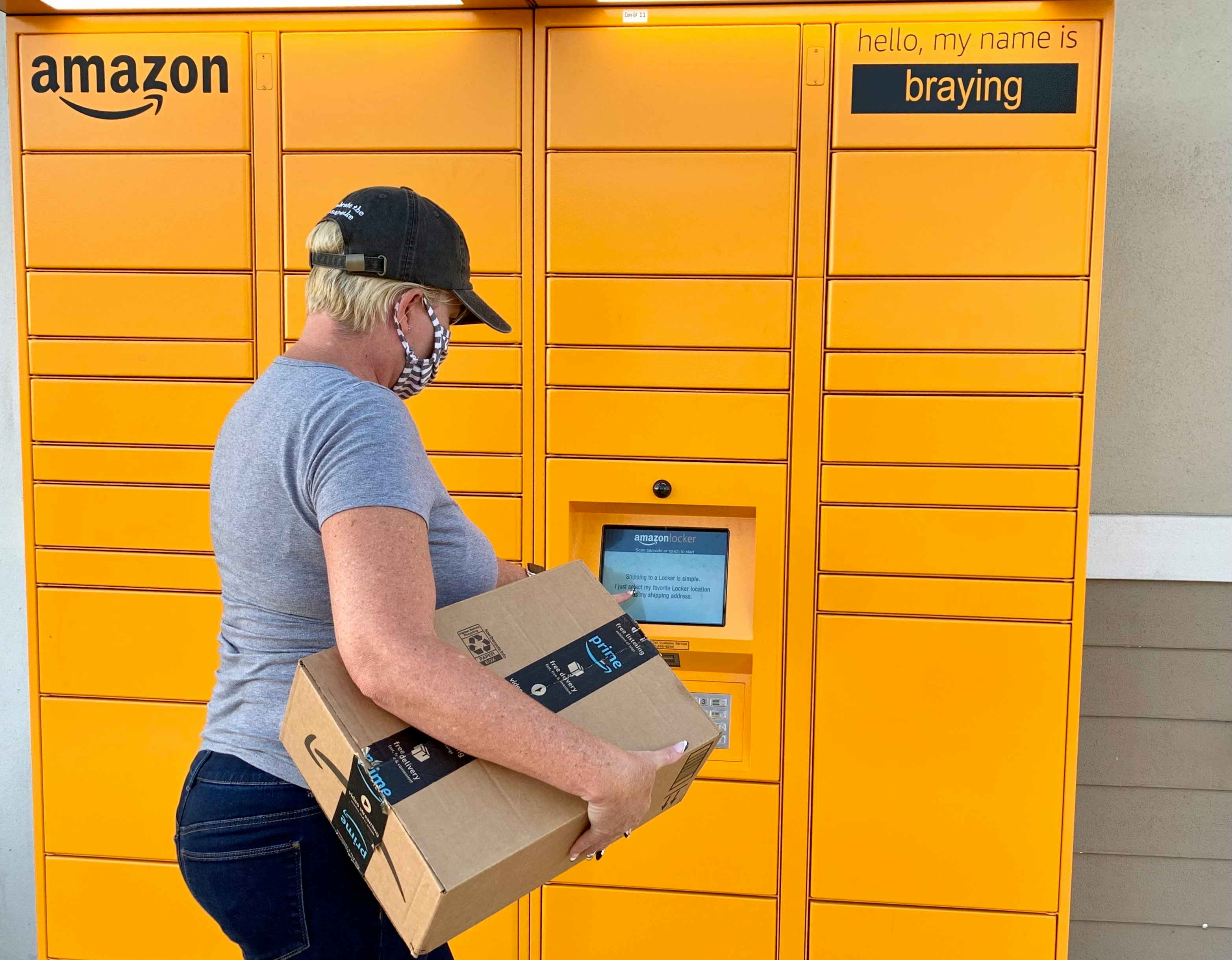 woman returning amazon package at locker