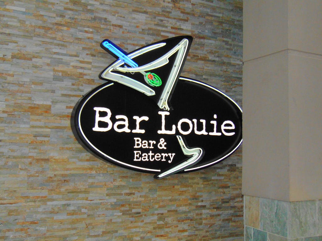 Bar Louie restaurant sign on a wall.
