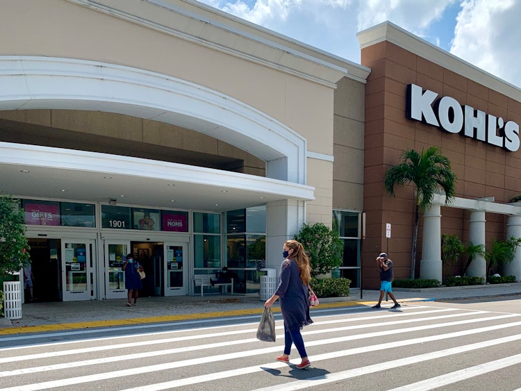 woman walking into kohls store