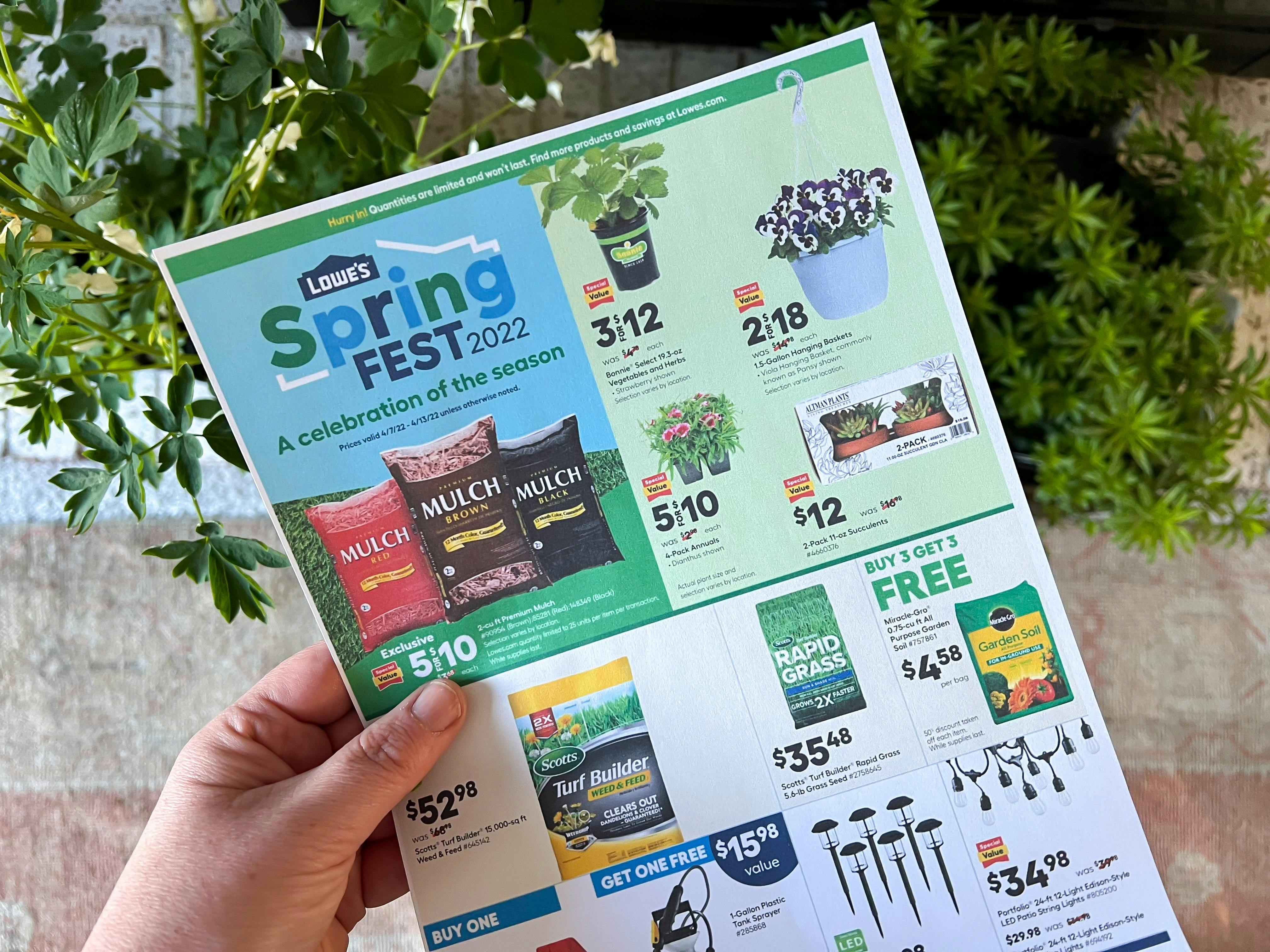 Someone holding a printed ad for Lowe's Springfest 2022