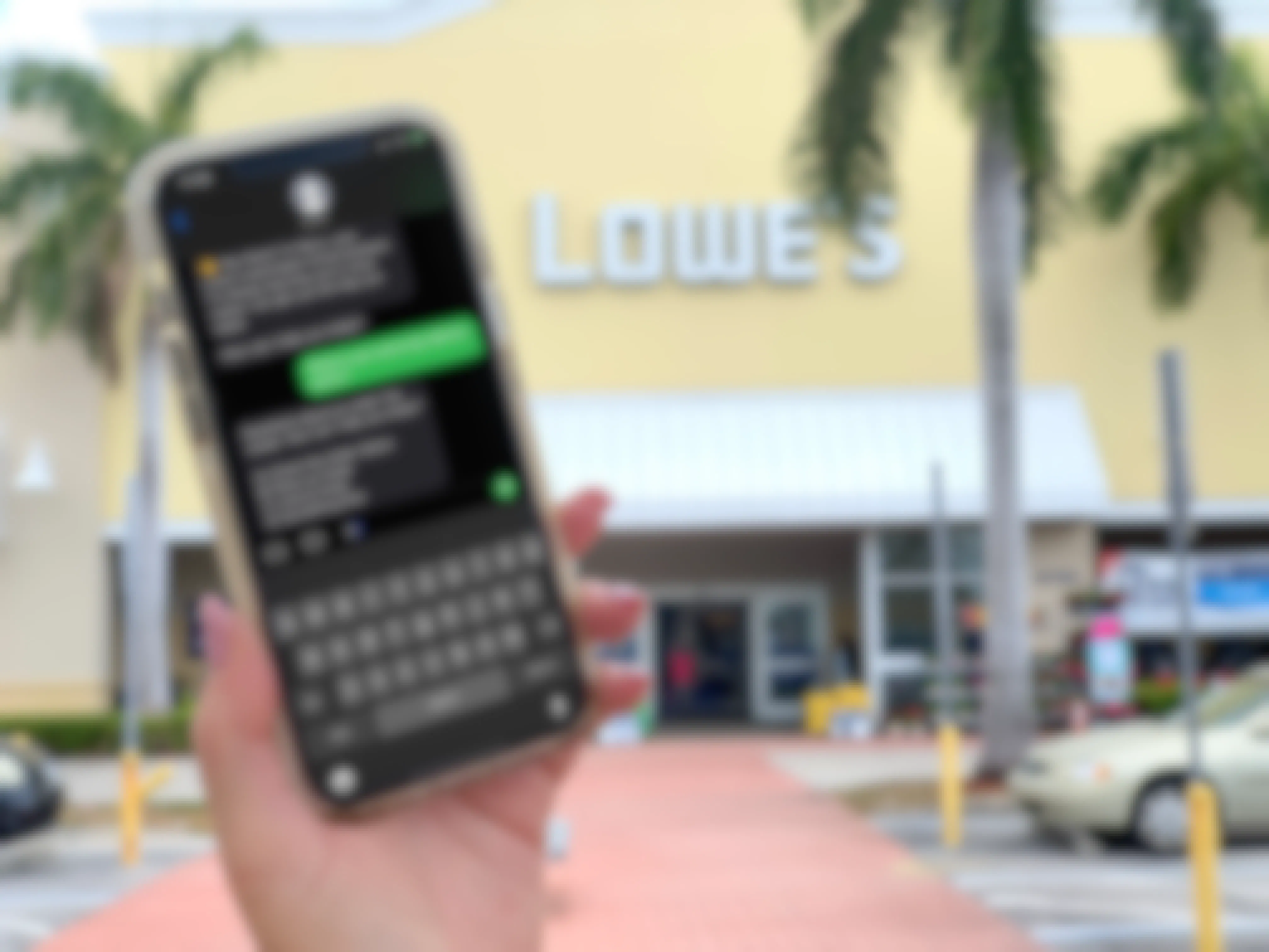 hand holding cellphone with costumer service text at lowes store