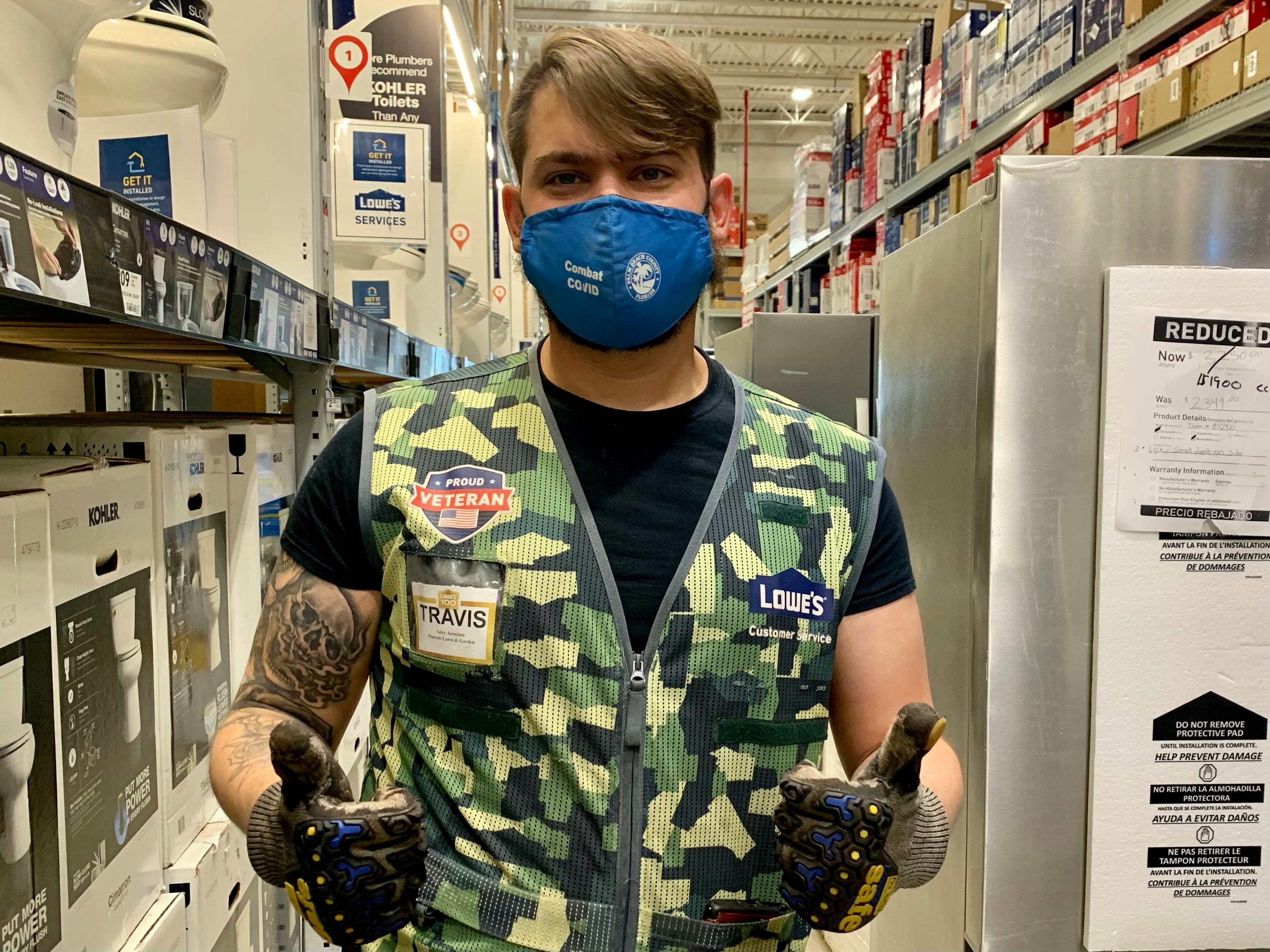 veteran lowes employee giving a thumbs up