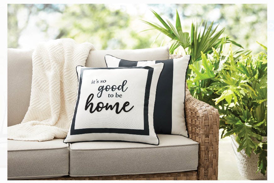 A pillow sitting on a couch.