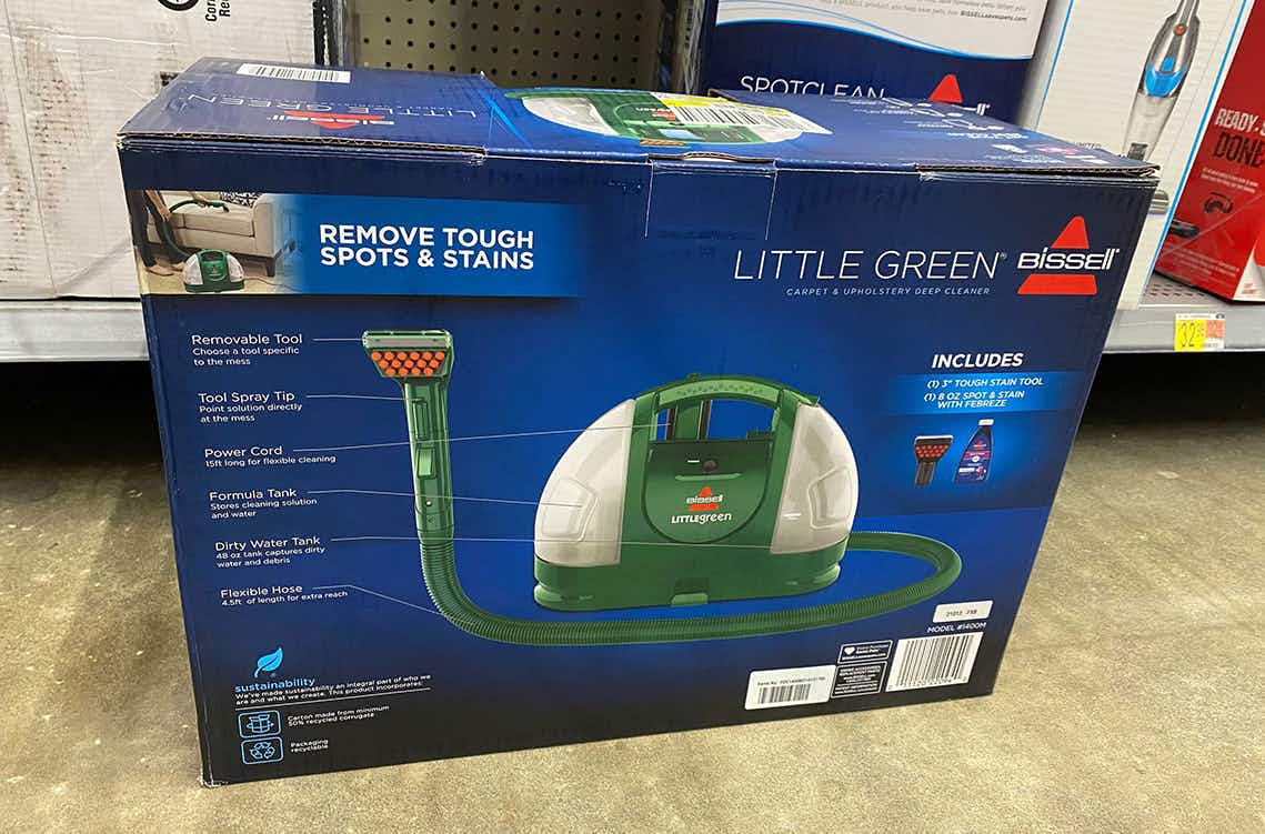 bissell little green cleaner machine in a box sitting on the floor at walmart