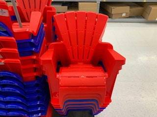 red plastic kids adirondack chairs stacked at walmart