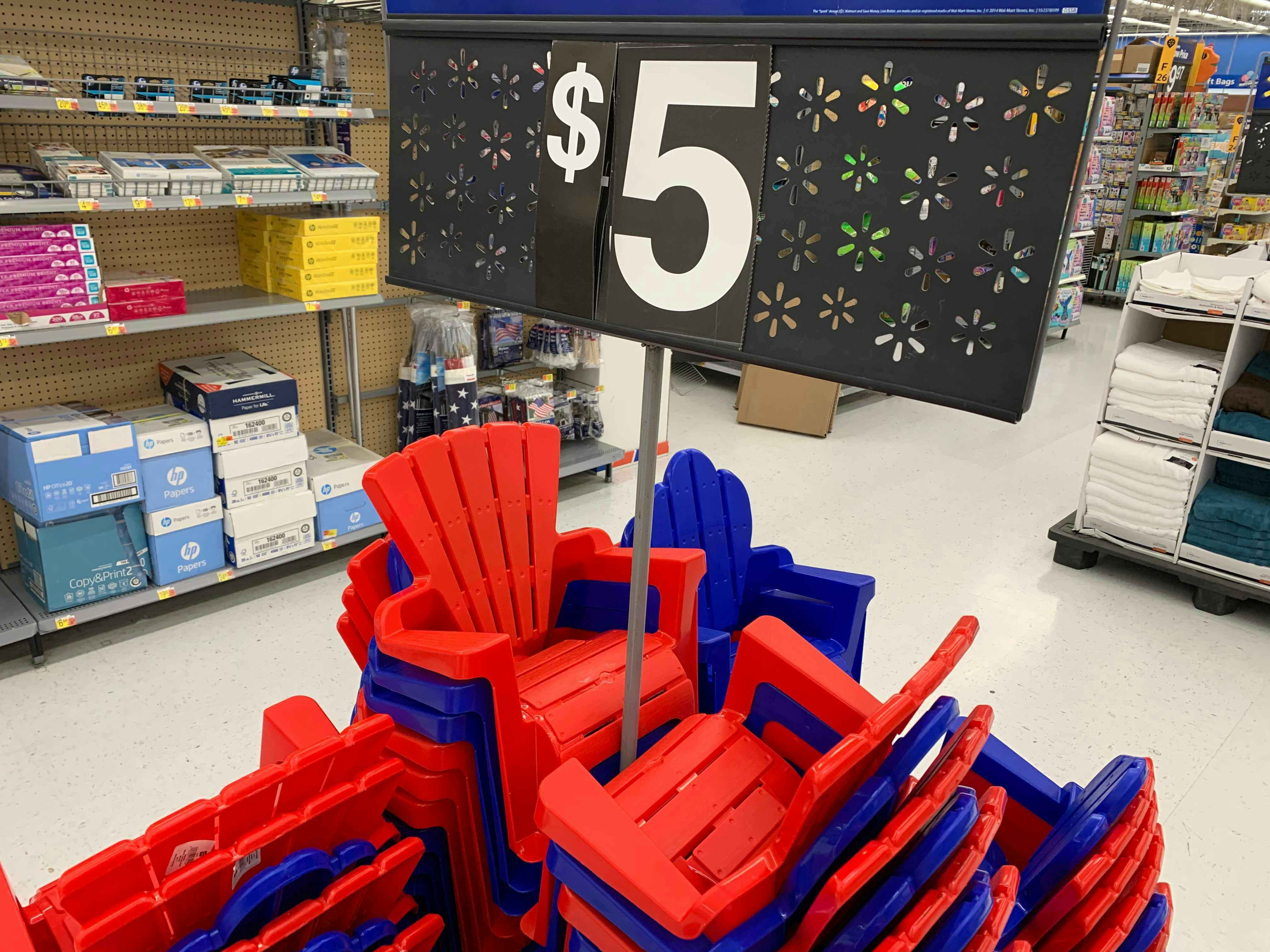 kids plastic red and blue adirondak chairs stacked around a $5 everyday low price at walmart