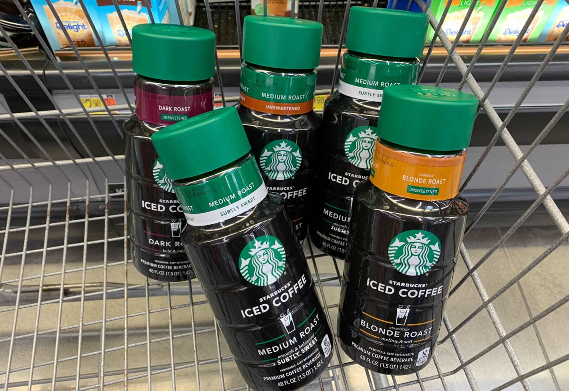 Five Starbucks iced coffee bottles in a Walmart cart