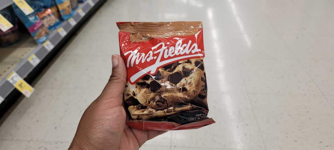 hand holding mrs fields cookie