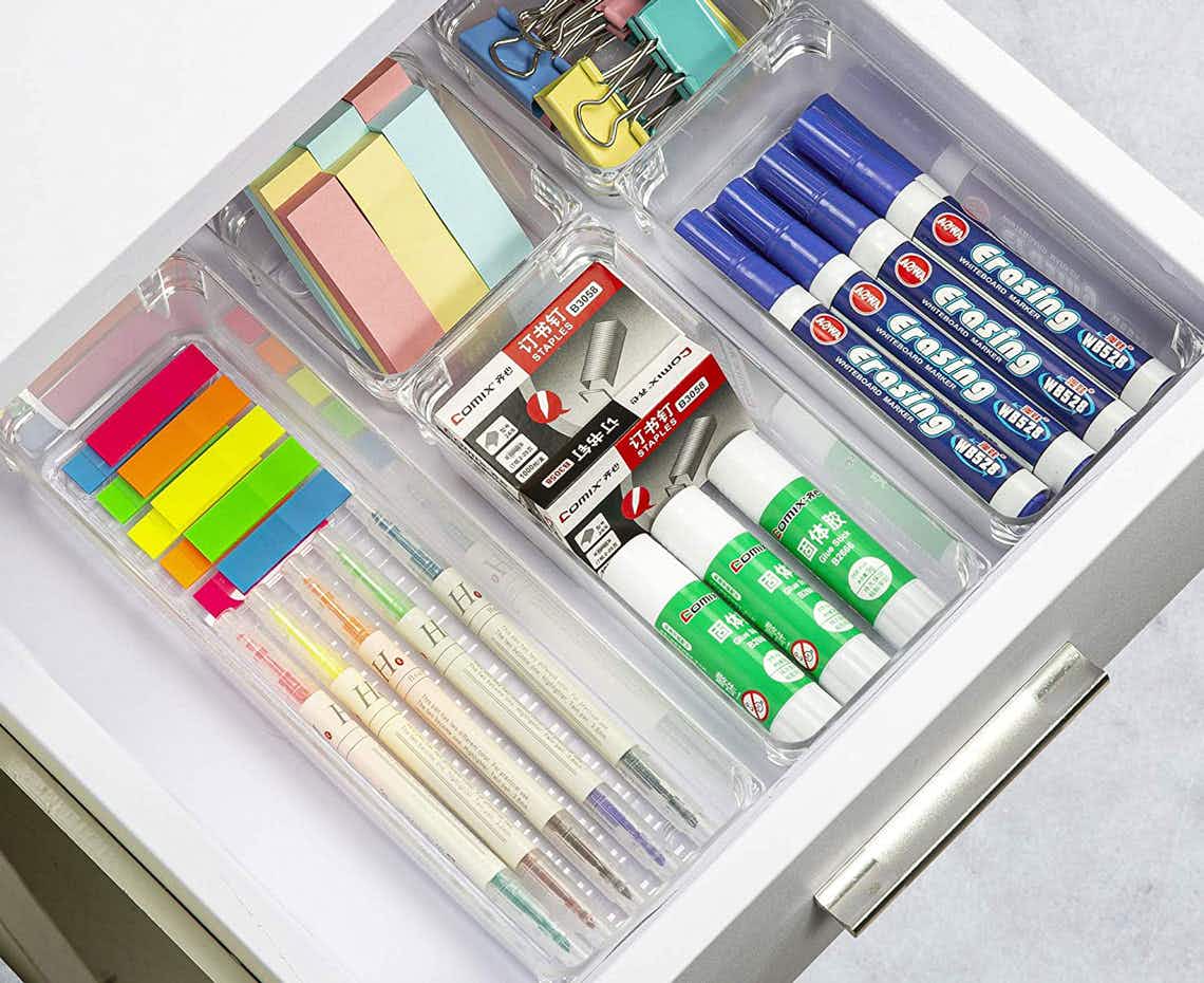 office supplies organized in bins in a drawer
